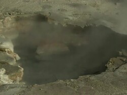 Medium Close Up static - Steam rises from a hot spring. / Wyoming, USA Stock Footage