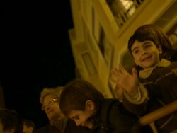 High Speed children smiling, cheering and waving at barrier, Three Kings Fiesta, Spain Stock Footage