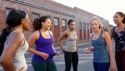 MS Smiling women in discussion after run on summer morning through city streets Stock Footage