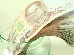 Savings Thai Money in a Jar Stock Footage