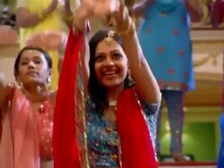 Medium shot women performing Bollywood-style dance number / man joining main dancer Stock Footage