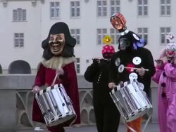 MS Shot of people wearing mask and celebrating in Basel Carnival (Basler Fasnacht) / Basel, Switzerland Stock Footage
