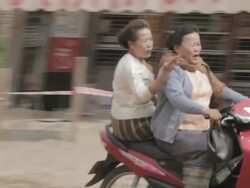 MS PAN two women riding scooter / Vientiane, Laos Stock Footage