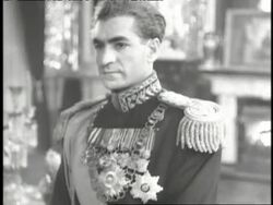 The Shah of Iran Mohammed Reza Pahlavi poses in uniform. News Clip