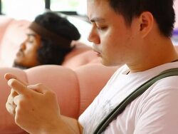 Young Adults with touchscreen phone Stock Footage