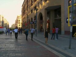 MS People walking on busy path way in front of stores  / Yerevan, Armenia Stock Footage