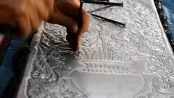 Silver art handicrafts of Lanna, Thai style, Chiang Mai, Thailand, hand banging on silver with a hammer. Stock Footage
