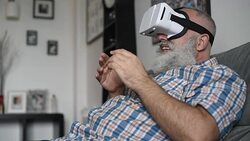 adult senior man and a virtual reality headset. graybearded man using vr glasses Stock Footage