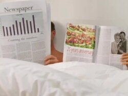 Couple Reading In Bed Stock Footage