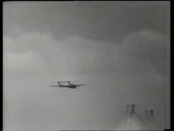 B/W PAN of de Havilland night fighter jet flying past camera / Air show / England / SOUND Stock Footage