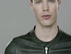 Portrait of young handsome man looking at camera Stock Footage