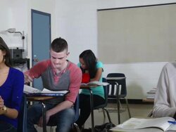 High School students in a classroom. Teacher helps. Stock Footage