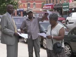 MS Man handing out flyers and his business card to  couple talking to him on  street AUDIO  / New York City, New York, United States Stock Footage