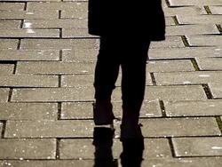 MS Shot of Child tiptoes over paving stones, avoiding stepping on cracks / London, United Kingdom  Stock Footage