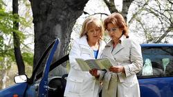 Mature woman reading the road map. Stock Footage