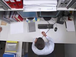 HD CRANE: Multitasking Businessman Stock Footage