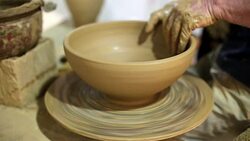 man creates pottery on a potter's wheel Stock Footage