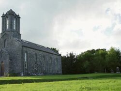 WS SLO MO View of 19th century church outside of town / Westport, County Galway, Ireland Stock Footage