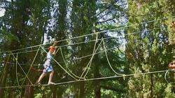 boy in the municipal rope park Stock Footage
