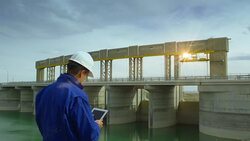 HD: Engineer Inspecting Hydroelectric  Dam Stock Footage