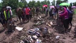 Field of wreckage marks the spot where the ill-fated Lao Airlines plane struck the ground before disappearing into the Mekong River News Clip