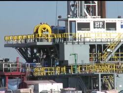 A small Texas town located atop one of the nation''s most productive natural gas fields is awaiting a new round of test results after state regulators found a cancer-causing pollutant in the air. News Clip