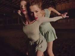 wide shot of two dancers dancing in wooden barn Stock Footage
