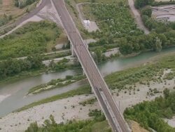 WS AERIAL TS Shot of express train crossing bridge over river / Rhone Alpes, France Stock Footage