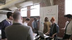 Entrepreneurs meeting and planning at whiteboard in office Stock Footage