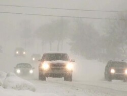 Winter snowstorm. Car traffic on slippery road. Stock Footage