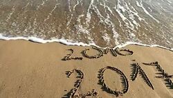 New year 2017 and old year 2016 written in sand Stock Footage