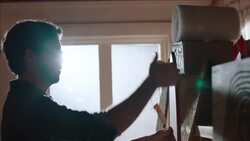 Shop owner hangs price tags on new skateboards Stock Footage