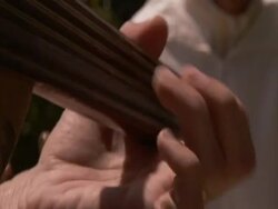 CU fingers pressing down on frets of Oud, an arabic string instrument in Alhambra, Grenada, Spain, (sound available) Stock Footage