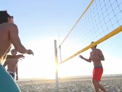 Men playing beach volleyball. Stock Footage