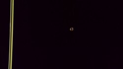 SLO MO. Football soars over the crossbar and between the uprights for successful field goal. Stock Footage