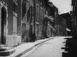 1950: BEAULIEU: DORDOGNE VALLEY:  MS Sign, 'Beaulieu'. HA WS SCENIC Beaulieu landscape w/ the Dordogne River. VS Belcastel Church building & other houses, postman delivering mail to doorsteps in village street, elderly female signing for package. Instructional Video