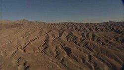 Ridges ripple across sand dunes surrounding the Hoover Dam. Stock Footage