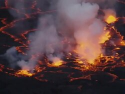 CU Steam rising from fiery Nyiragongo lava lake / Goma, Virunga National Park, Democratic Republic of the Congo Stock Footage
