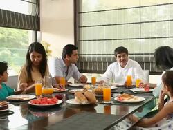 Family eating breakfast in a dining room  Stock Footage