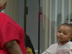 2009 MS TD Mother and young son son waiting at counter in job center/ Antioch, California, USA/ AUDIO Stock Footage