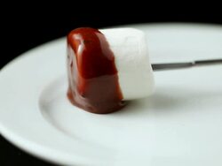 ECU Placing marshmallow coated in chocolate on plate / Seoul, South Korea Stock Footage