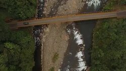 AERIAL Car crossing a bridge over the river Stock Footage