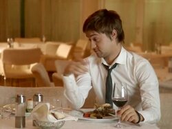 Young drunk man in restaurant Stock Footage