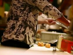 MS Shot of Japanese restaurant , Sushi prepared inside VW bus / Sao Paulo, Brazil  Stock Footage