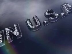 Camera moves over "MADE IN U.S.A" raised lettering on metal surface. Stock Footage