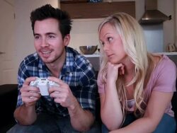 Couple playing on the sofa with game console Stock Footage