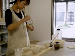 MS Shot of Potter women are painted bowl glaze / Kyoto, Japan Stock Footage