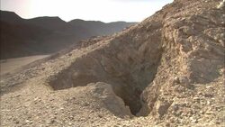 A cave opens into an abandoned emerald mine in the ancient city of Sikait, Egypt. Stock Footage