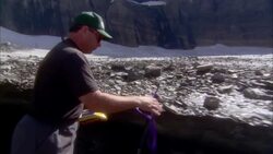 A geologist runs tests in Glacier National Park, Montana. Stock Footage