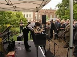 Charles bemused by squeeky toy musical instrument News Clip